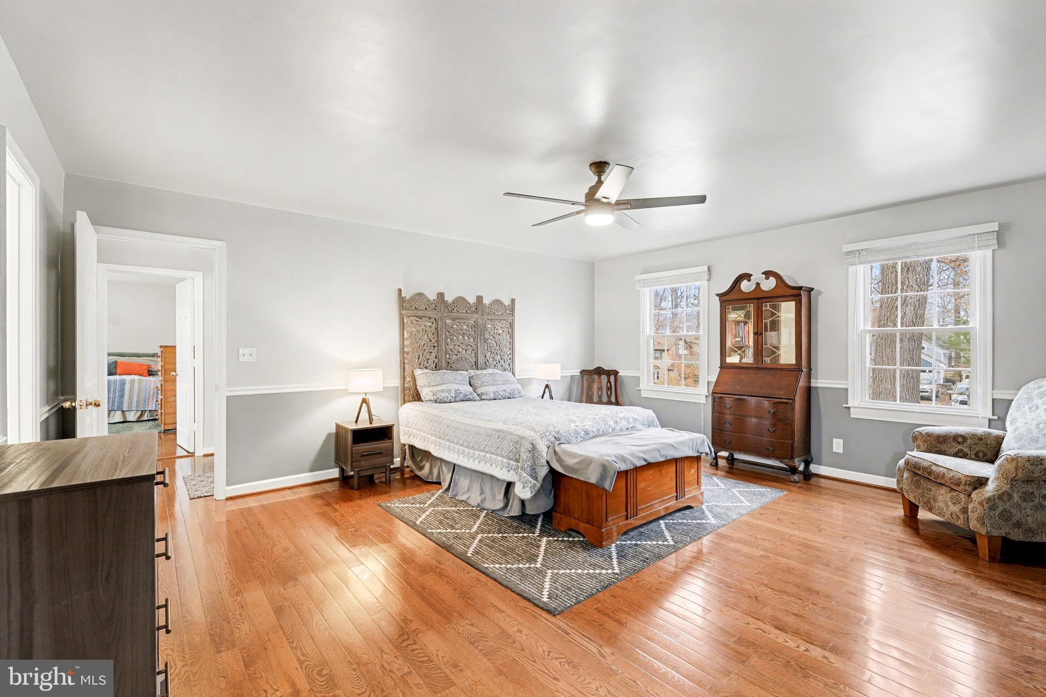 1114 John Paul Jones Drive Stafford, VA 22554 - Photo 22 of 74 a spacious bedroom with a bed a couch and a dresser in it