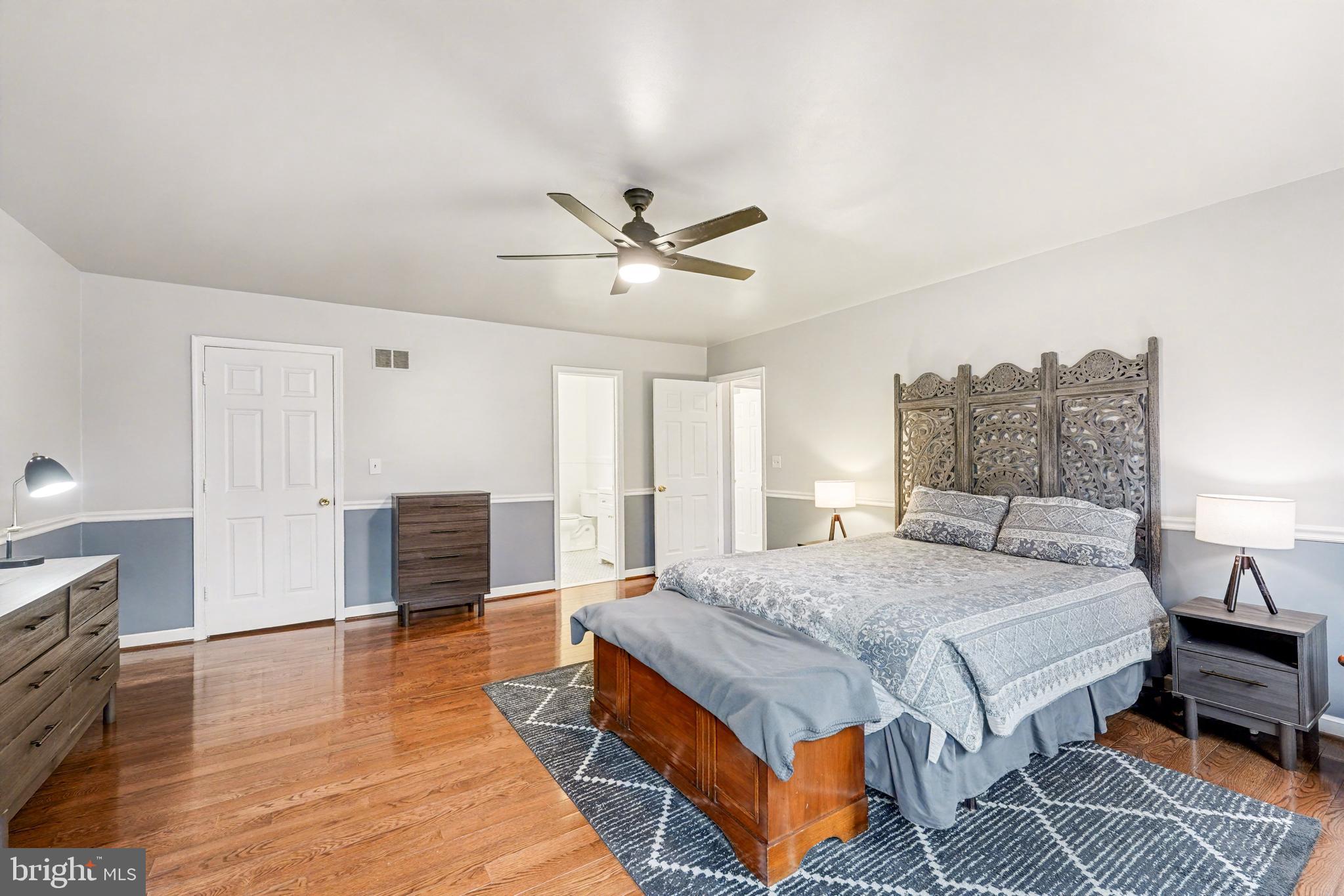 1114 John Paul Jones Drive Stafford, VA 22554 - Photo 23 of 74 a spacious bedroom with a bed and a table in it