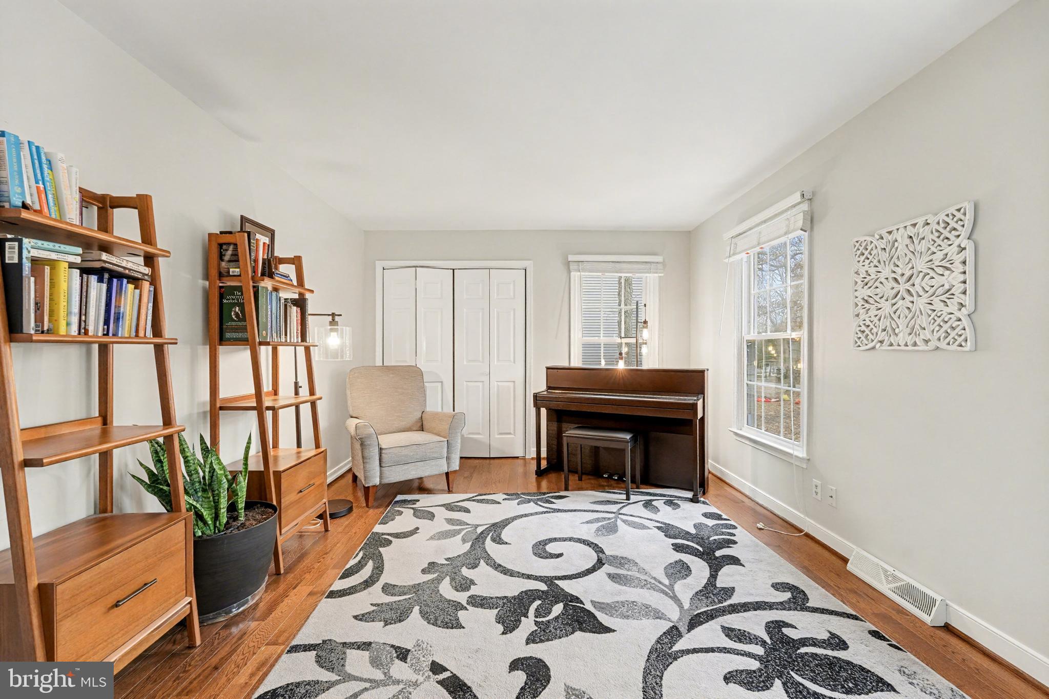 1114 John Paul Jones Drive Stafford, VA 22554 - Photo 4 of 74 a bedroom with furniture and a book shelf