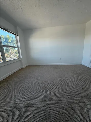 an empty room with a empty space and window