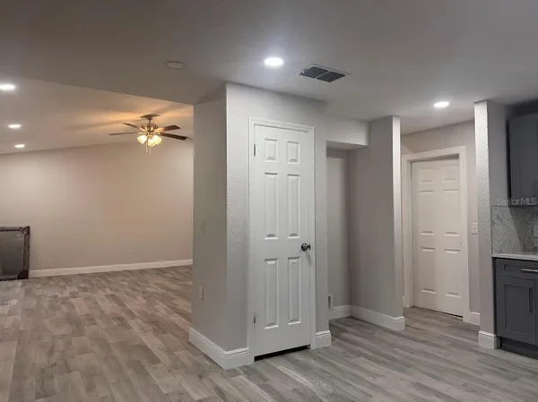 an empty room with wooden floor