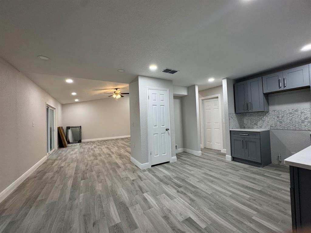 12142 Caper Street Orlando, FL 32837 - Photo 6 of 15 a view of a kitchen with a sink and a refrigerator