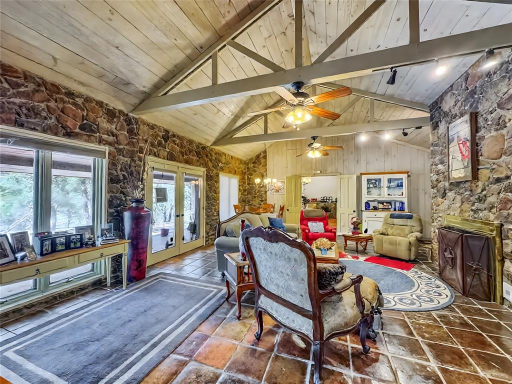 5167 Rockhill Road Aubrey, TX 76227 - Photo 12 of 29 a living room with fireplace furniture and a rug