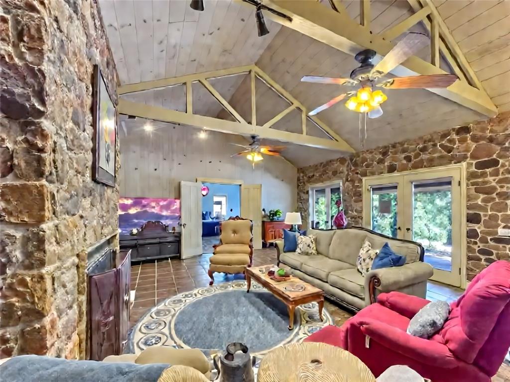 5167 Rockhill Road Aubrey, TX 76227 - Photo 13 of 29 a living room with furniture and a chandelier