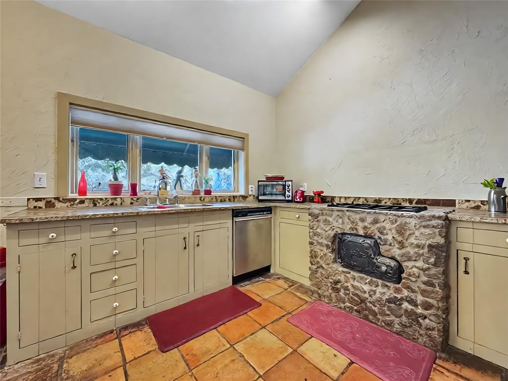 5167 Rockhill Road Aubrey, TX 76227 - Photo 15 of 29 a open kitchen with granite countertop a sink and cabinets
