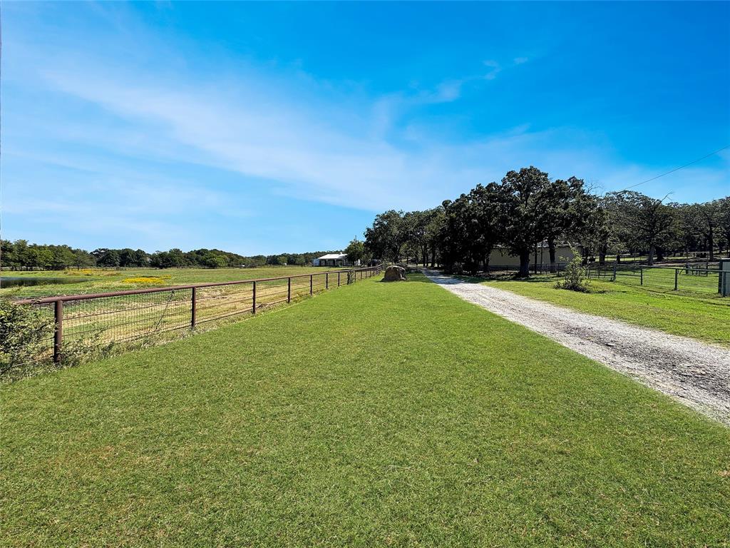 5167 Rockhill Road Aubrey, TX 76227 - Photo 24 of 29 a view of a lake with houses in the background
