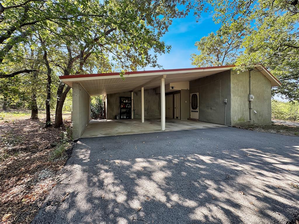 5167 Rockhill Road Aubrey, TX 76227 - Photo 28 of 29 a view of a house with a yard and large tree