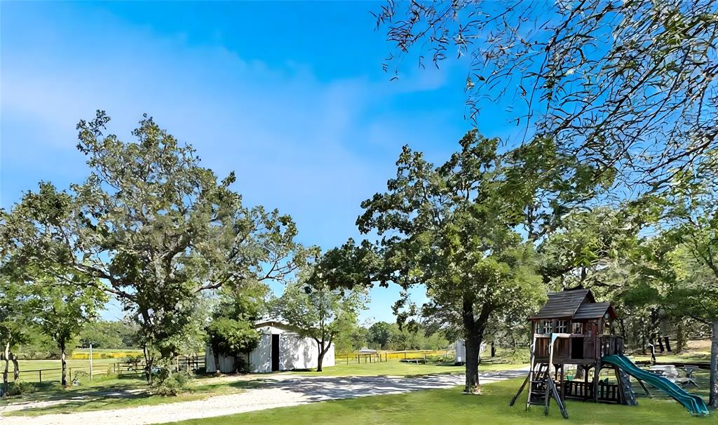 5167 Rockhill Road Aubrey, TX 76227 - Photo 7 of 29 a view of a park with large trees