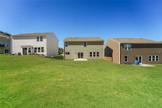 a view of a house with a big yard
