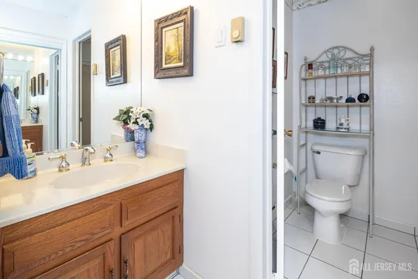 a bathroom with a toilet a sink and shower