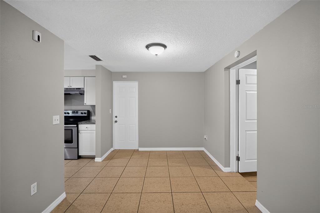 3834 Warren Ridge Street Sarasota, FL 34233 - Photo 8 of 31 a view of a kitchen with a sink and a refrigerator