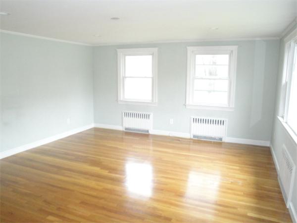 122 Bacon Road Barnstable, MA 02601 - Photo 2 of 18 a view of empty room with wooden floor and fan