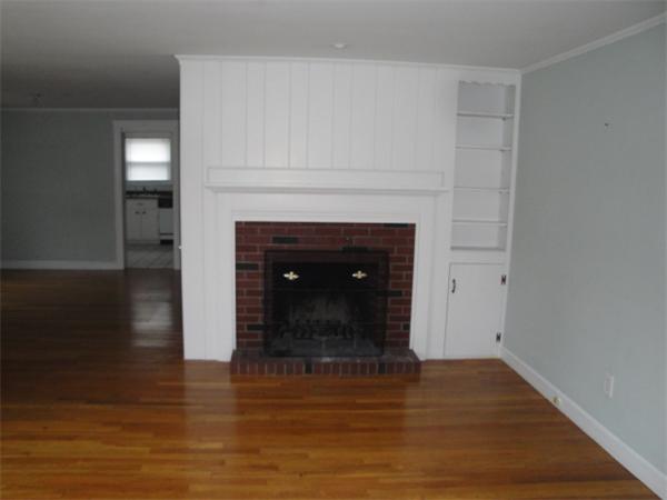 122 Bacon Road Barnstable, MA 02601 - Photo 5 of 18 a living room with a fireplace