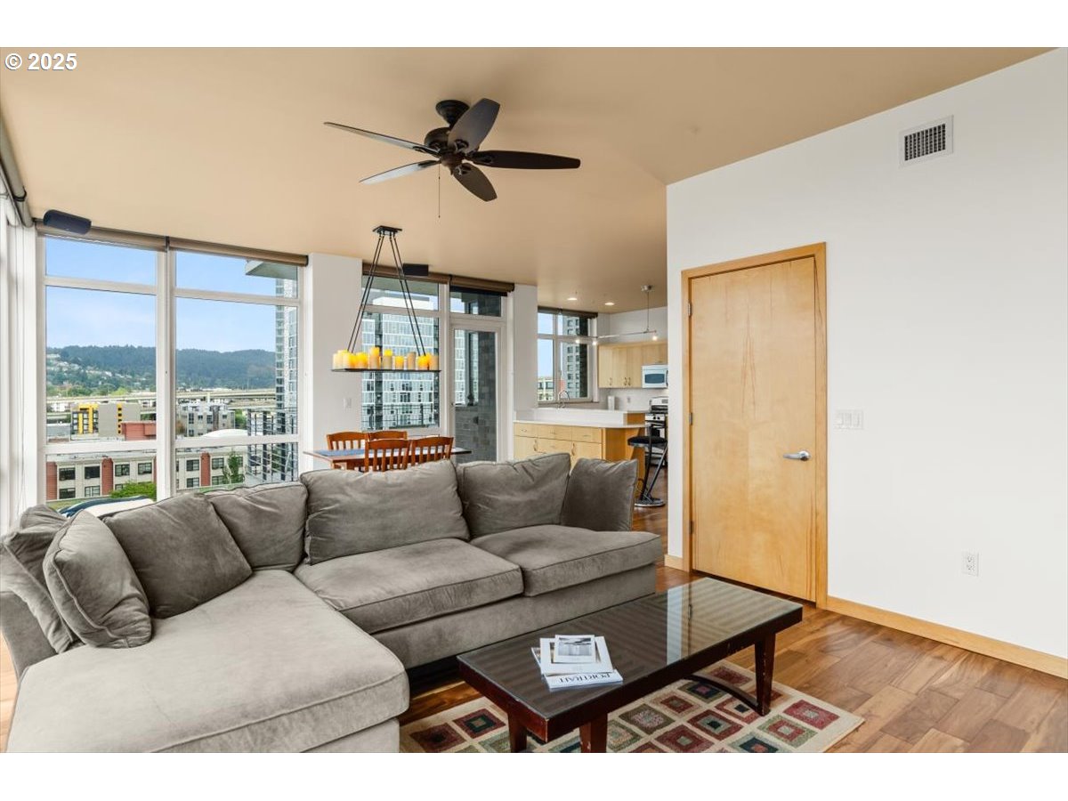 1255 Northwest 9th Avenue, Unit 910 Portland, OR 97209 - Photo 20 of 43 a living room with furniture and a large window