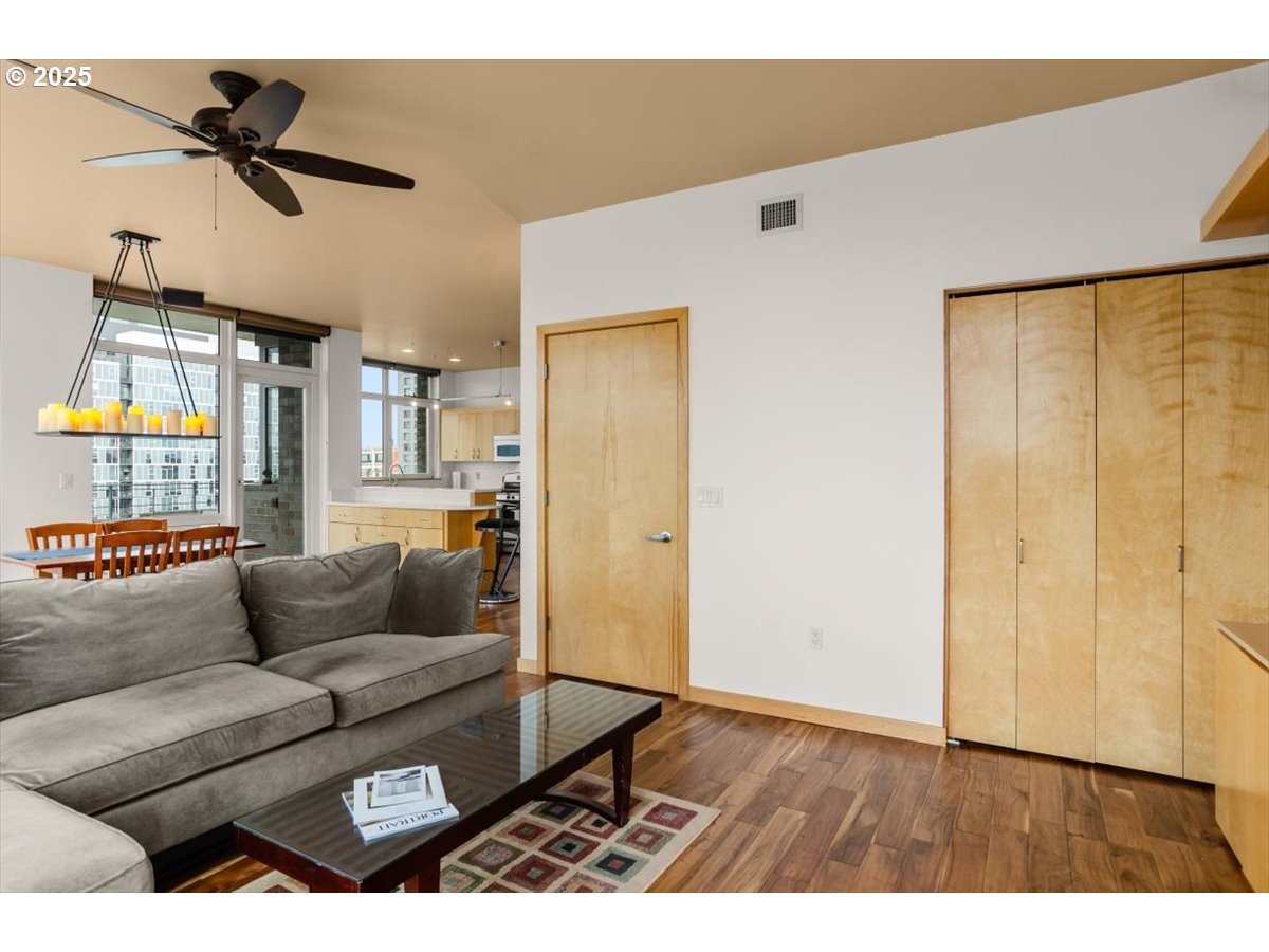 1255 Northwest 9th Avenue, Unit 910 Portland, OR 97209 - Photo 21 of 43 a living room with furniture and a window