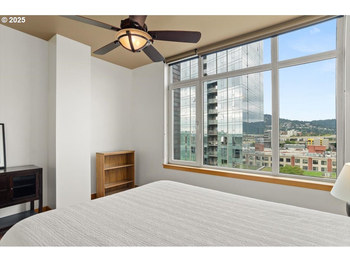 1255 Northwest 9th Avenue, Unit 910 Portland, OR 97209 - Photo 22 of 43 a bedroom with a bed and a large window