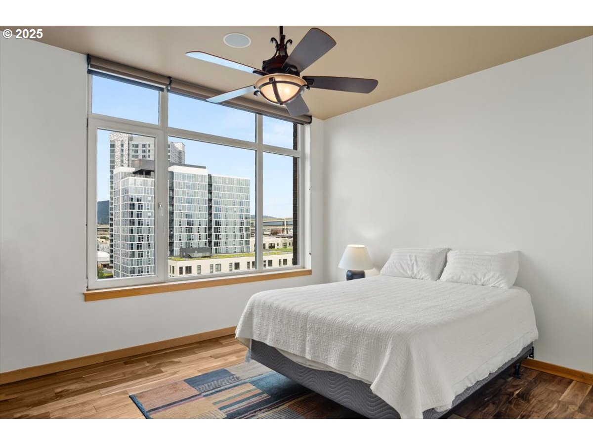1255 Northwest 9th Avenue, Unit 910 Portland, OR 97209 - Photo 23 of 43 a bedroom with a bed and a window