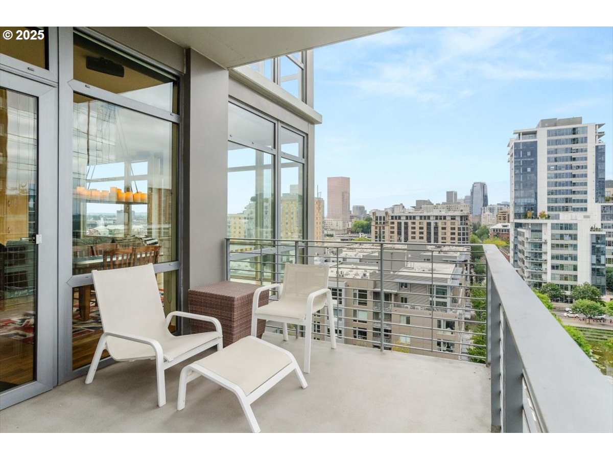 1255 Northwest 9th Avenue, Unit 910 Portland, OR 97209 - Photo 28 of 43 a view of a balcony with table and chairs