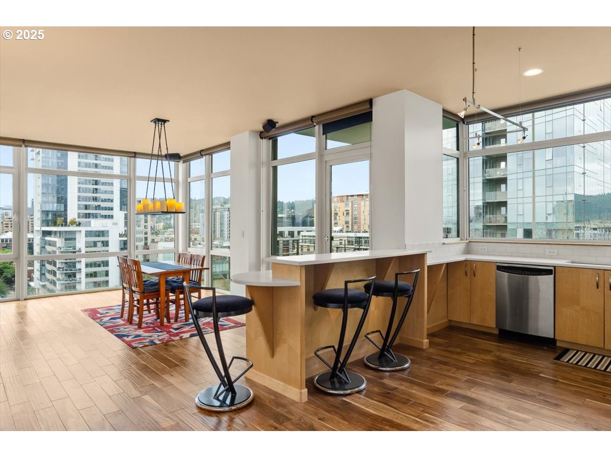1255 Northwest 9th Avenue, Unit 910 Portland, OR 97209 - Photo 7 of 43 a living room with furniture a window and appliances