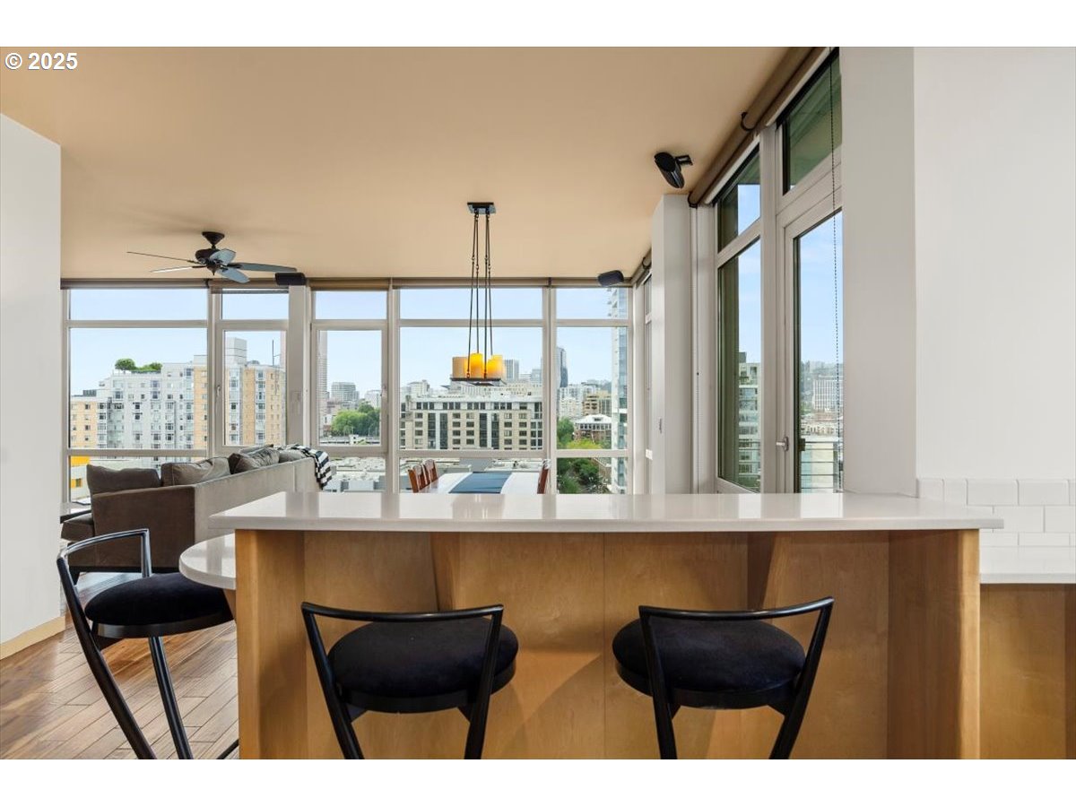 1255 Northwest 9th Avenue, Unit 910 Portland, OR 97209 - Photo 8 of 43 a dining room with furniture and window