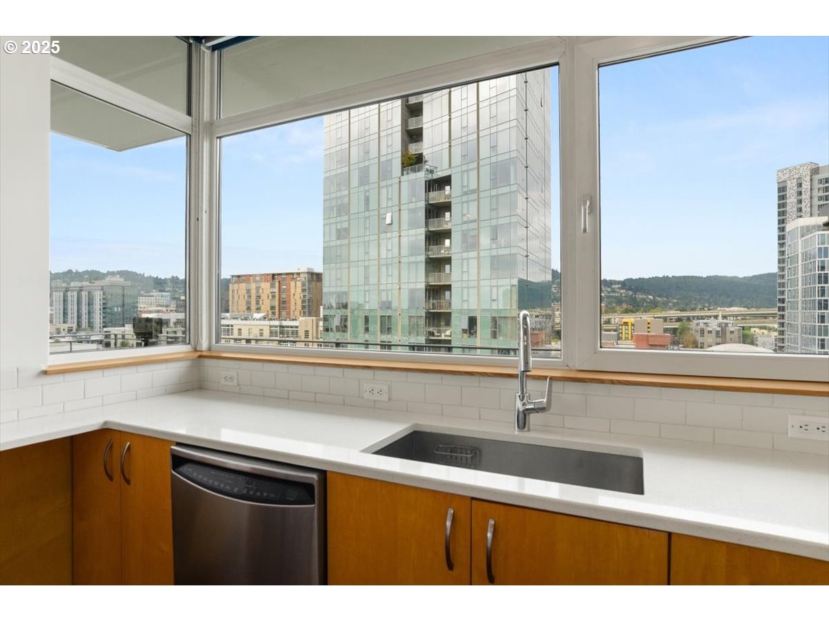 1255 Northwest 9th Avenue, Unit 910 Portland, OR 97209 - Photo 10 of 43 a kitchen with a sink and large window