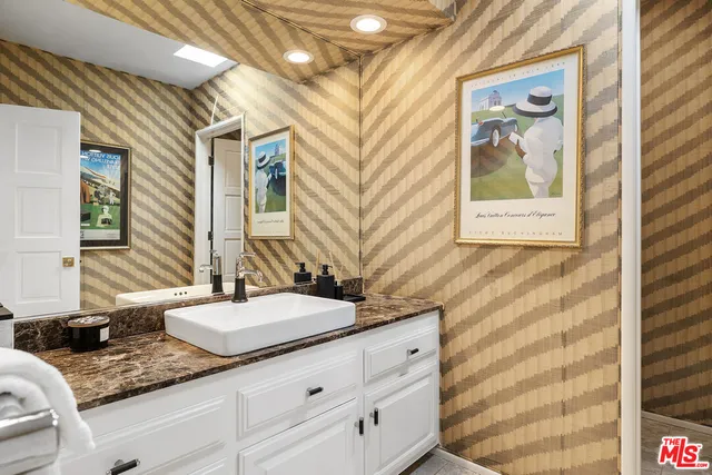 a kitchen with stainless steel appliances granite countertop a stove and a microwave