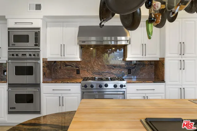 a dining room with furniture window and wooden floor