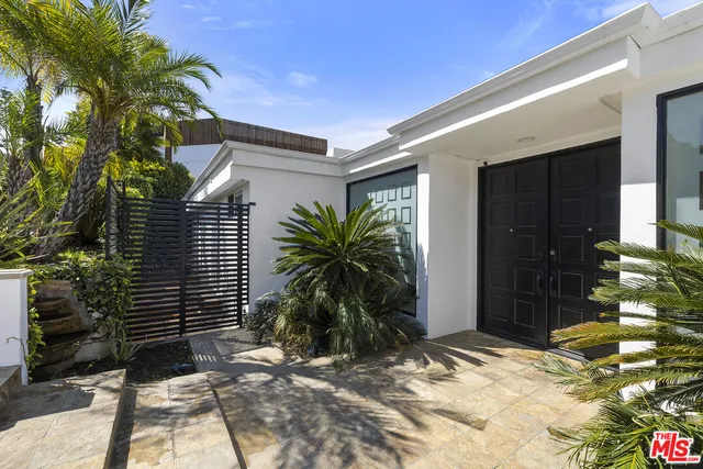 a house with a tree in front