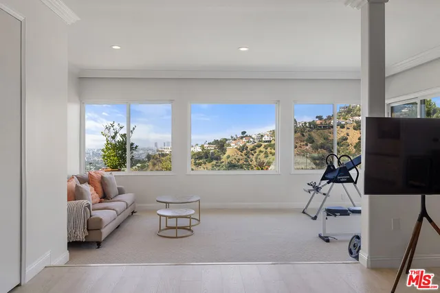 a large bathroom with a large tub and sink
