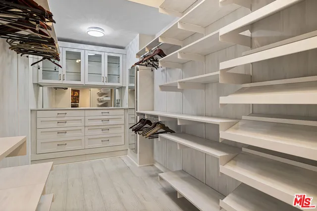 a view of a bathroom with a shower and a sink