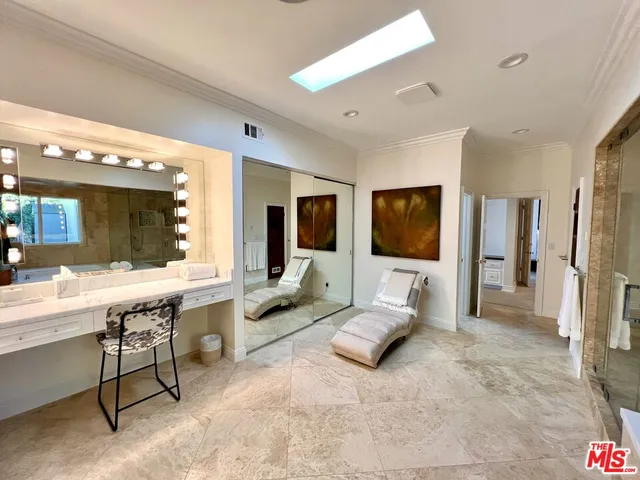 a bedroom with a bed and a fireplace