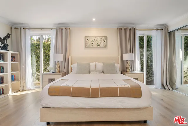 a view of a livingroom with workspace and a window