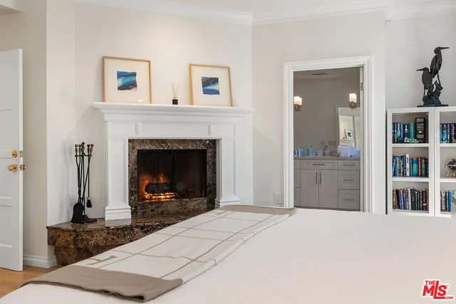 a bedroom with a bed and a table in it