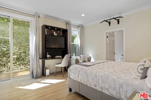 a view of a chairs and table in the backyard