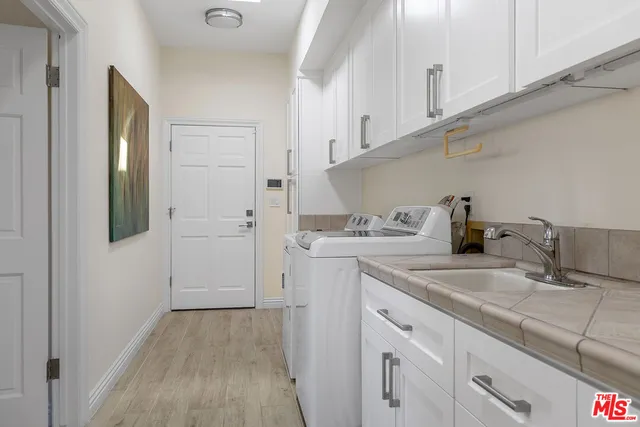 a view of a patio with couches and a table and chairs with garden view