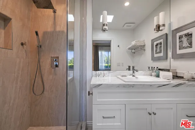 a view of a city street with a car parked