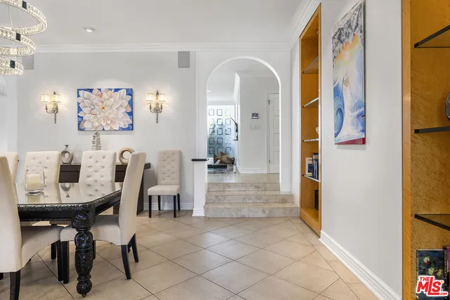 a view of a dining area with furniture and a chandelier