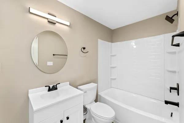 a bathroom with a sink a mirror and vanity
