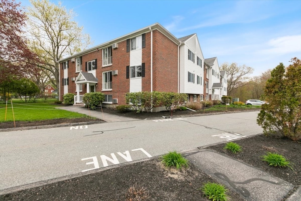 25 Clark's Road, Unit 101 Amesbury, MA 01913 - Photo 24 of 32 a view of a building with a street