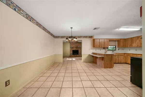 a kitchen with stainless steel appliances a sink and a refrigerator