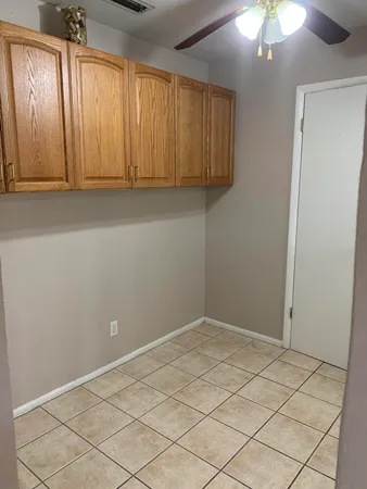 an empty room with fan