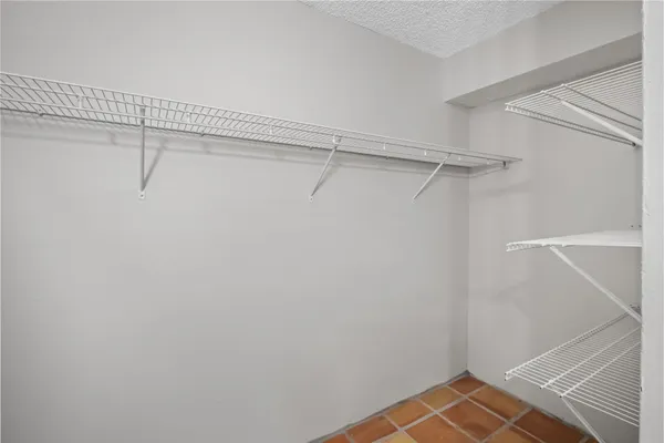 a view of a room with racks on the wall