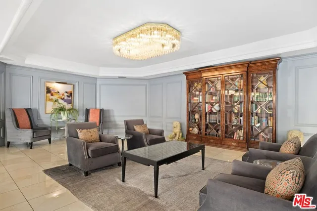 a view of a swimming pool with outdoor seating