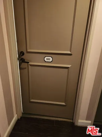 a view of a livingroom with furniture and windows