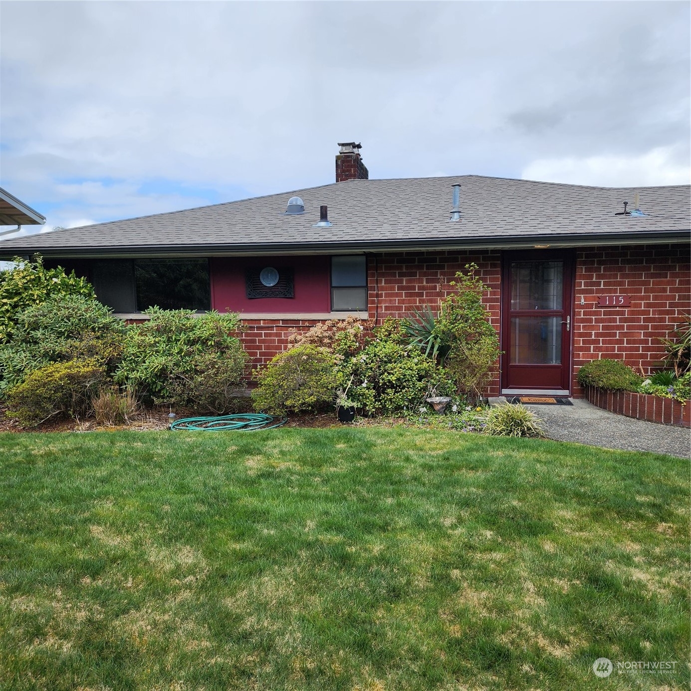 115 Monterey Place Northeast Renton, WA 98056 - Photo 1 of 35 a front view of a house with a yard