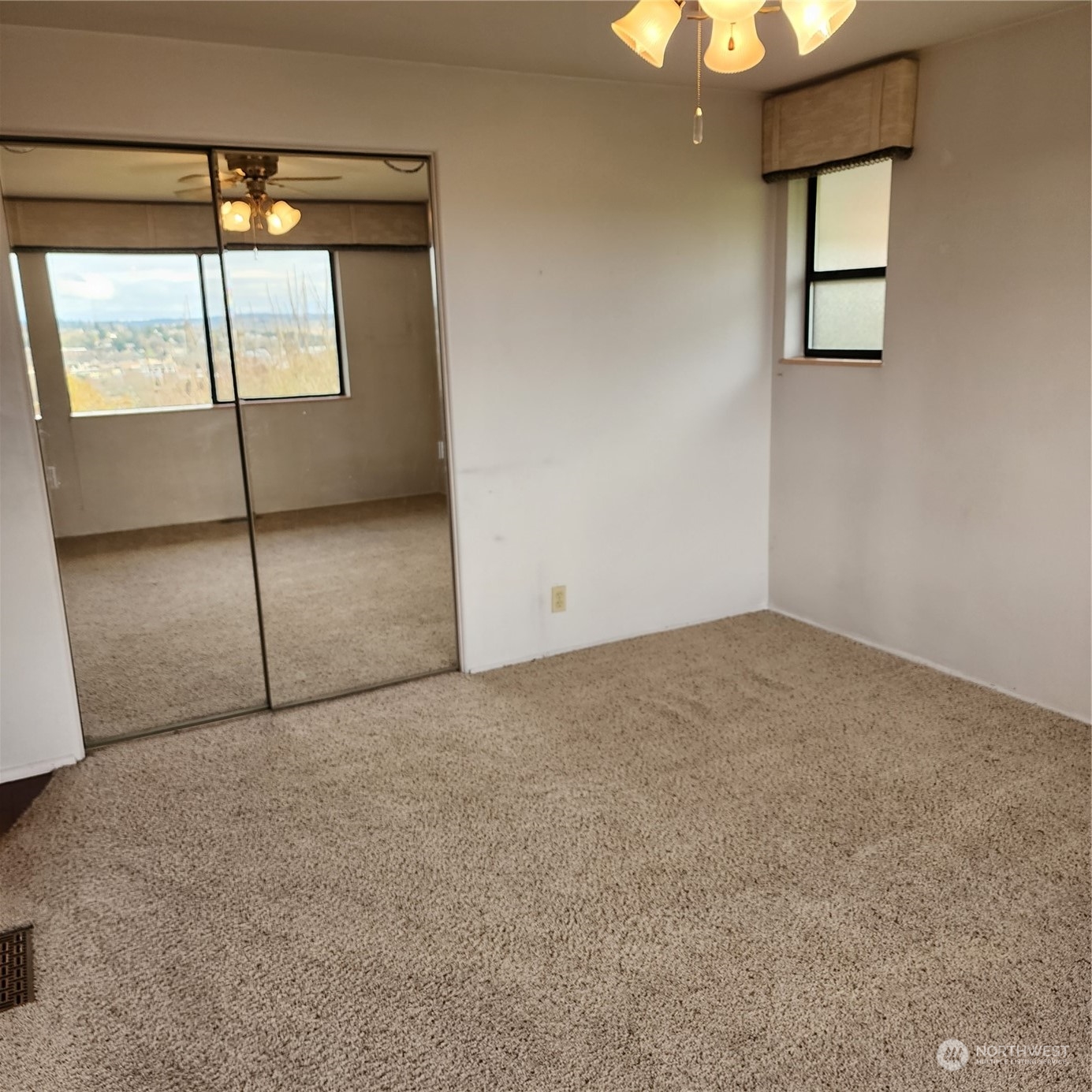 115 Monterey Place Northeast Renton, WA 98056 - Photo 14 of 35 a view of an empty room with a window