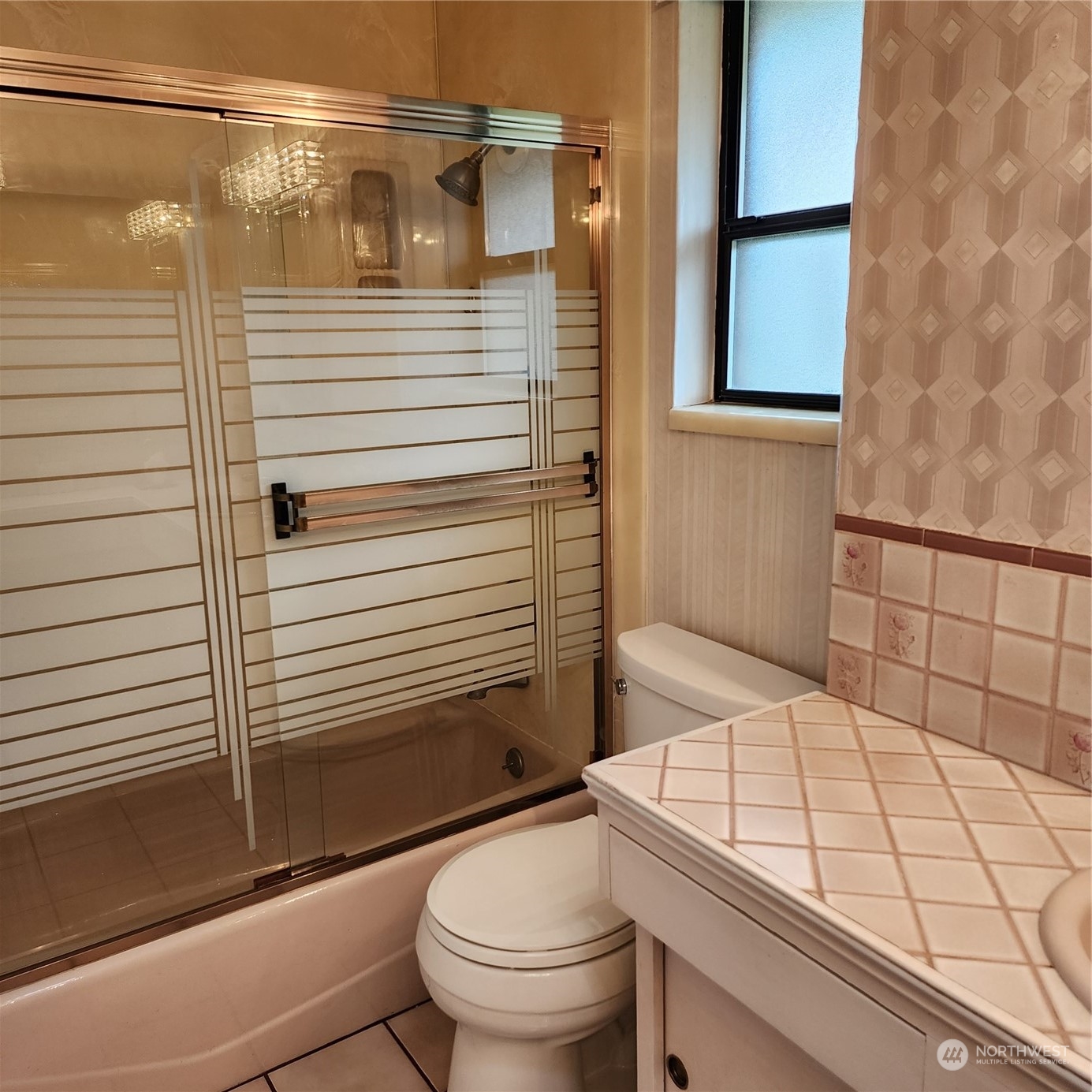 115 Monterey Place Northeast Renton, WA 98056 - Photo 18 of 35 a bathroom with a sink a toilet and shower