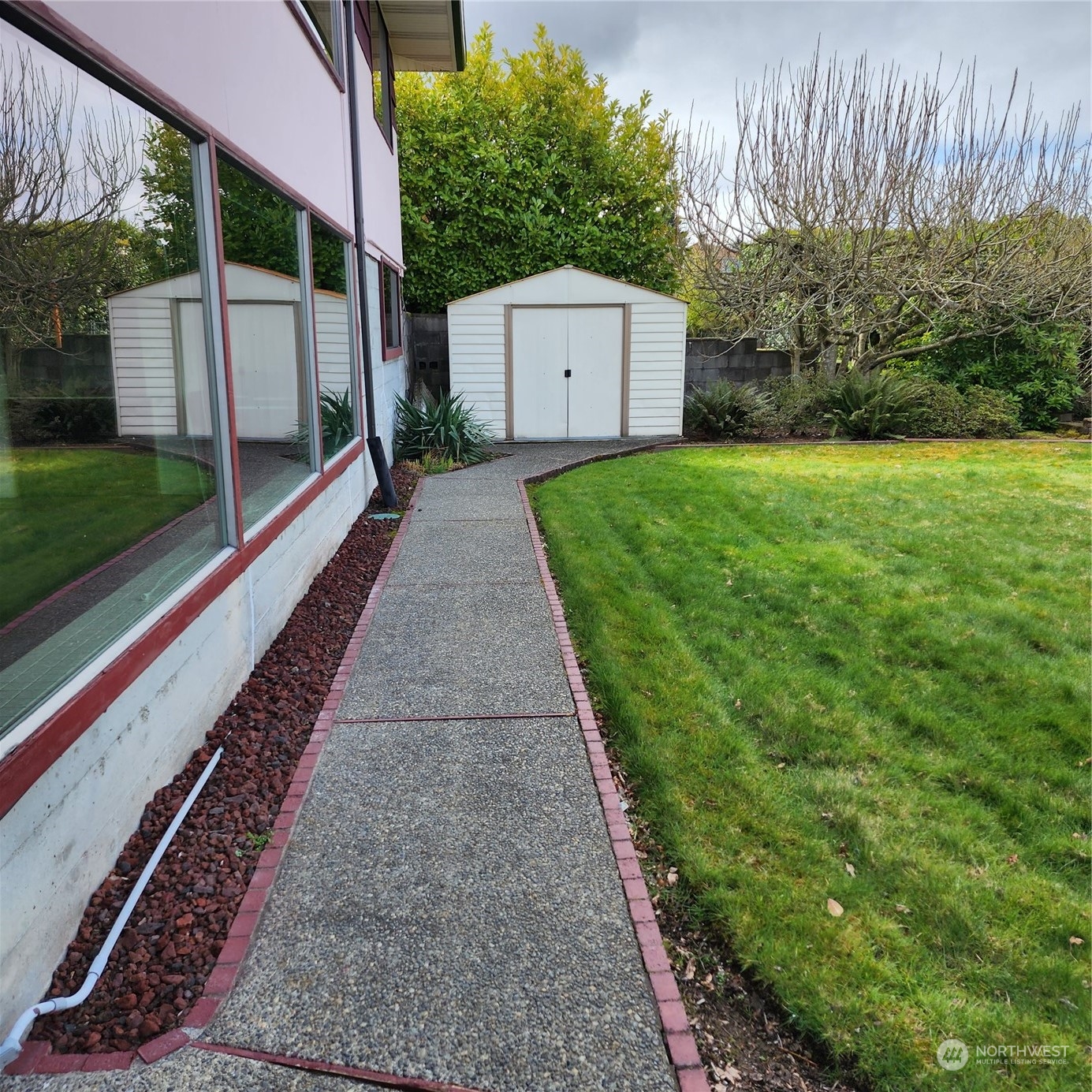 115 Monterey Place Northeast Renton, WA 98056 - Photo 27 of 35 a view of a backyard with potted plants