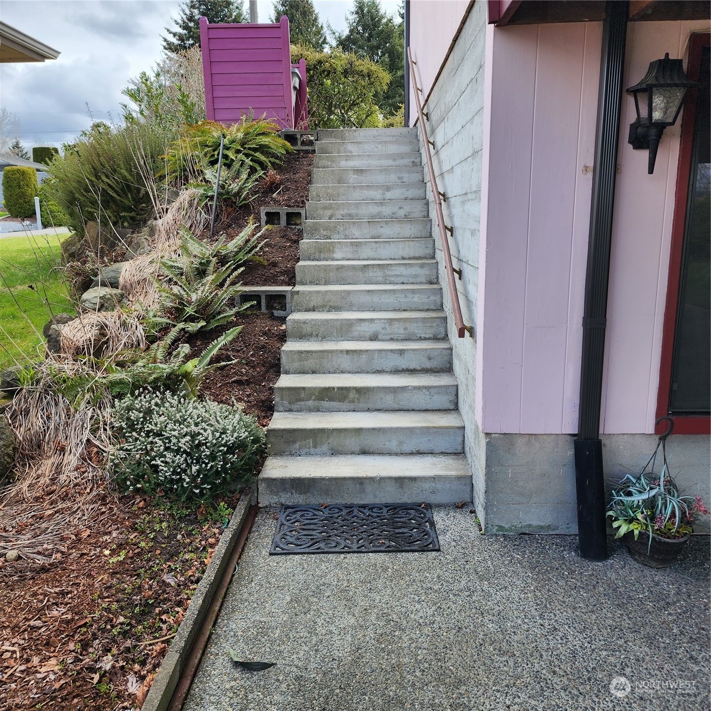 115 Monterey Place Northeast Renton, WA 98056 - Photo 28 of 35 a view of a pathway of a house with a yard