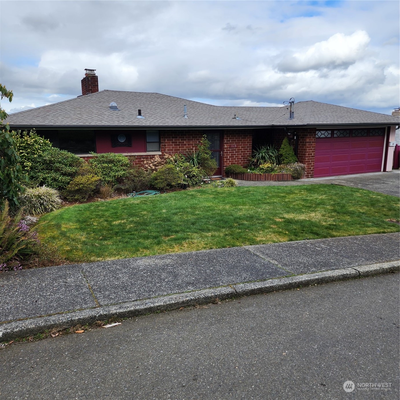 115 Monterey Place Northeast Renton, WA 98056 - Photo 3 of 35 a view of a house with a yard and garage